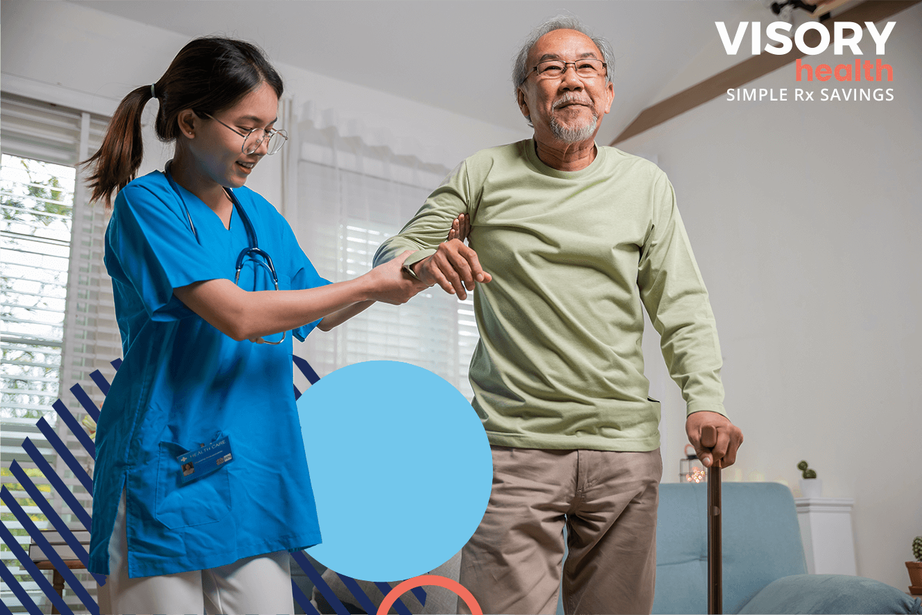 VIsory Health Blog Caring For A Vetern With Alzheimers Disease - Caretaker helping veteran stand with a cane